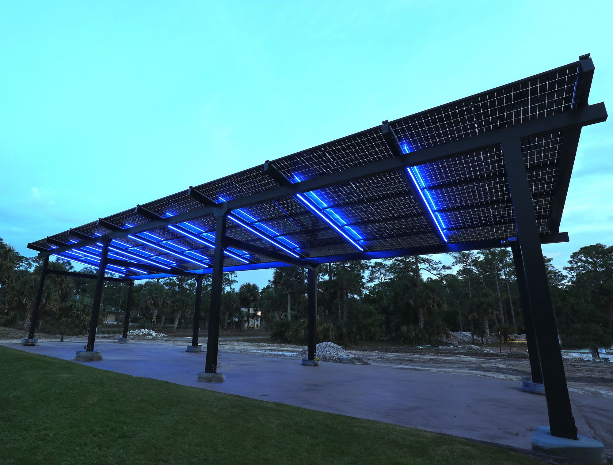 a solar panel covered area with blue lights