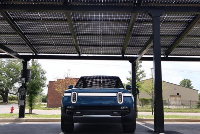 a car under a solar panel