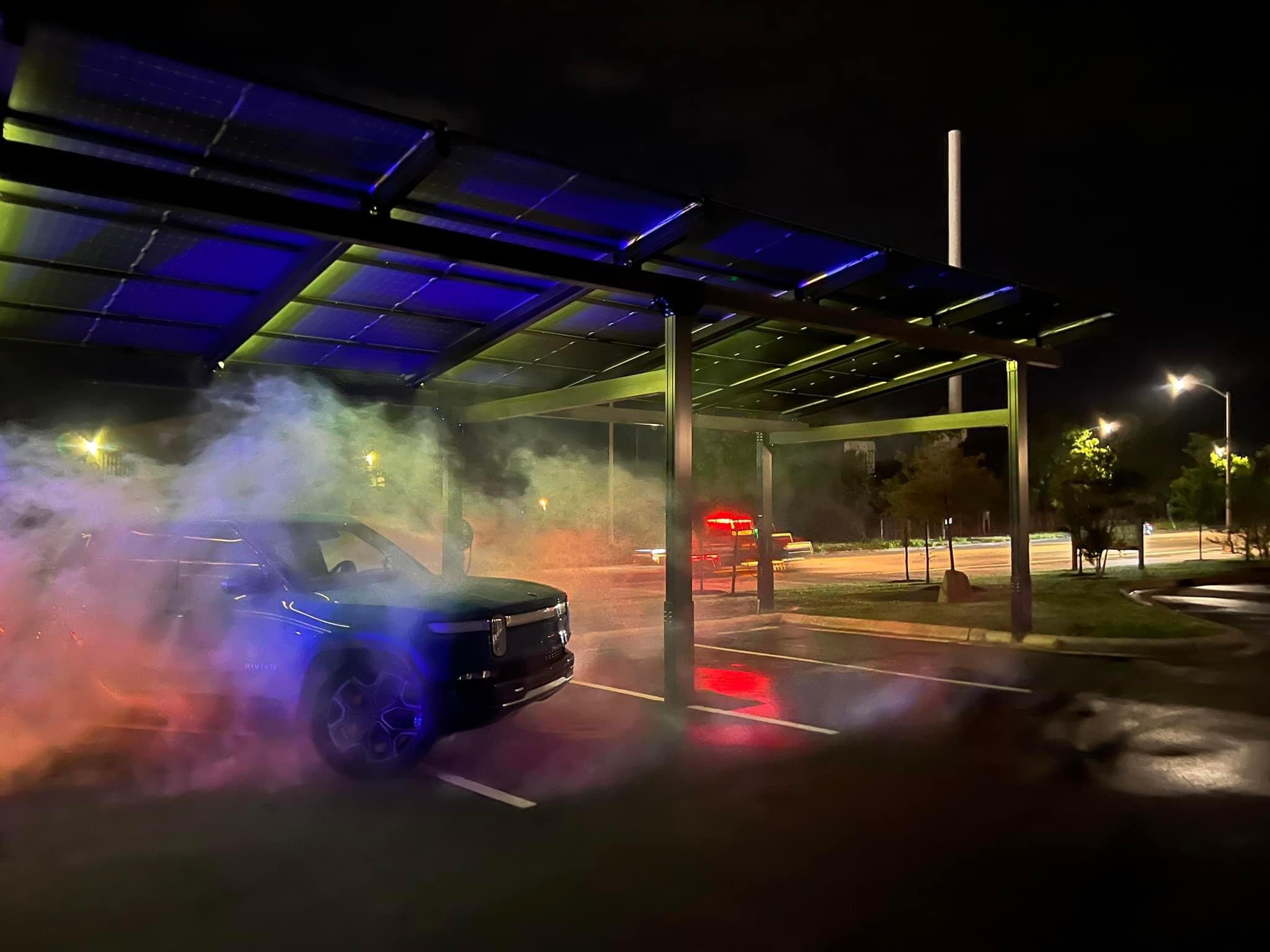 a car parked under a covered car shelter at night