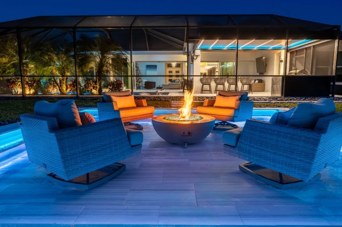A screened-in pergola at night