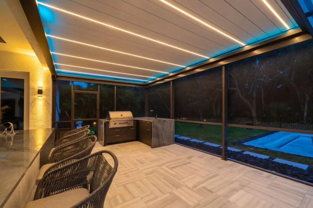 A screened in pergolas in Florida with a BBQ grill - enVision Pergola A screened in pergolas in Florida with a BBQ grill