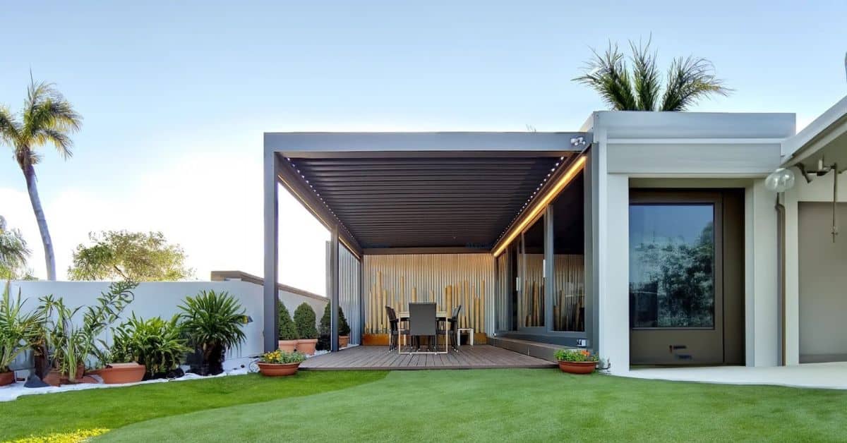 Modern aluminum louvered pergola in a Florida backyard with adjustable slats.