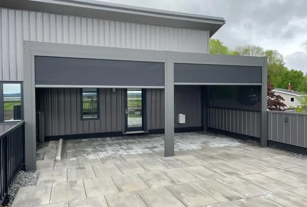 Outdoor pergola with motorized shade screens providing sun and privacy control on patio