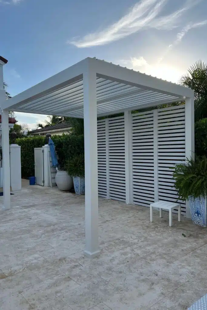 Wind Resistant Pergola With Adjustable Louvers - enVision Pergola White wind resistant pergola with adjustable louvered roof system
