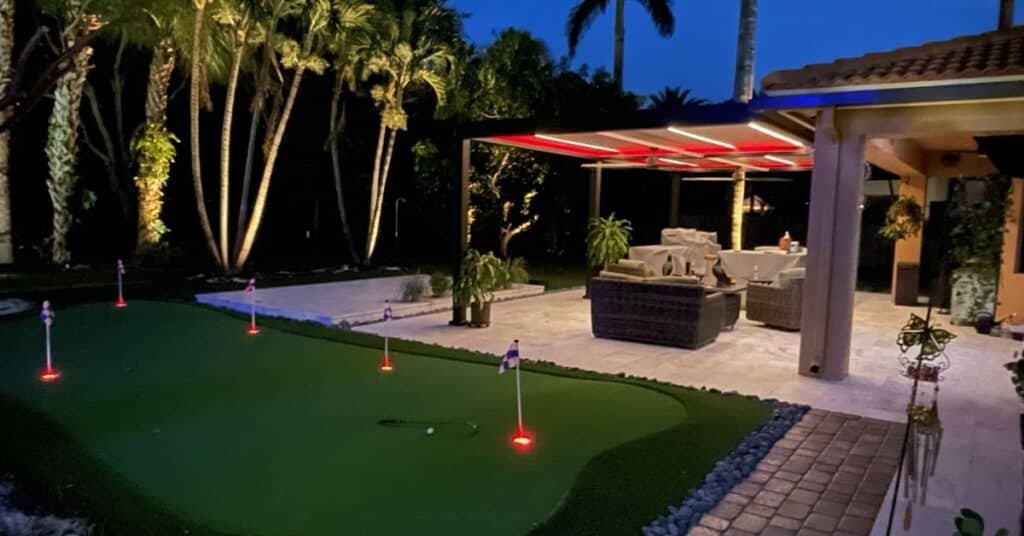 Wind resistant pergola with integrated lighting for nighttime outdoor use