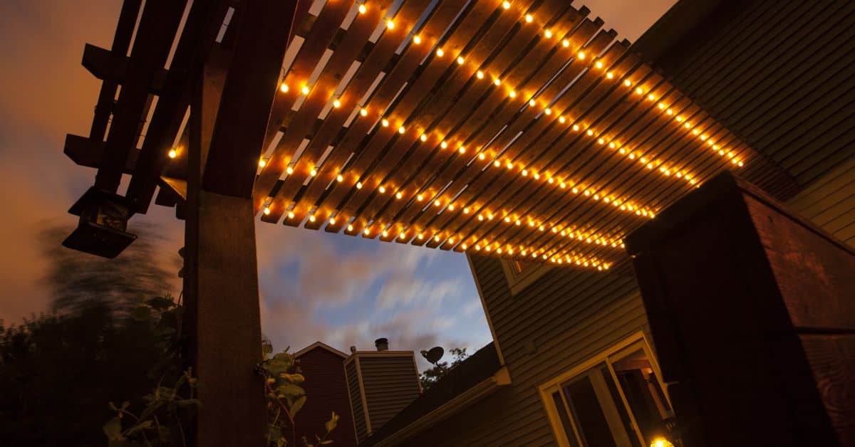Modern pergola lighting ideas with integrated LED ceiling lights for elegant outdoor ambiance